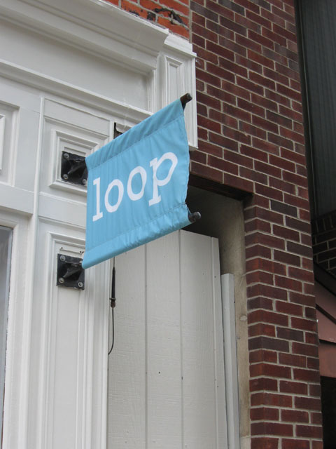 Light blue and white Loop Yarns Sign